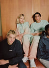 A.P.C. Asics - models lounging in a locker room