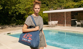 A.P.C. Women Sale Jeans - Woman and man walking together on school campus.