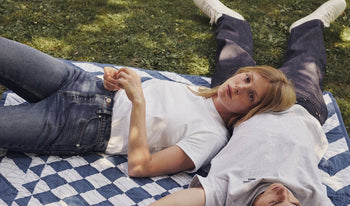 A.P.C. Women Jeans - Woman and man walking together on school campus.