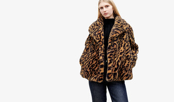 A.P.C. Women's Coats & Jackets - Woman wearing leopard print coat and blue jeans