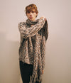 A.P.C. Gift Me More - a man model wearing a colorful sweater and scarf against a plain background