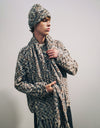 A.P.C. Men Gift Me More - Man wearing wool multicolor scarf, beanie, and sweater.