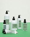 A.P.C. Small Gifts - Self care items displayed on green table.