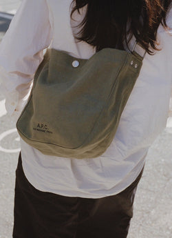 Woman with green Journal bag
