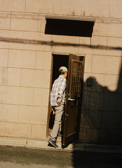 Man walking through door