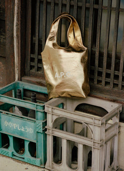 A.P.C. Gold ninon bag on plastic crates
