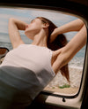 Woman leaning out of car window