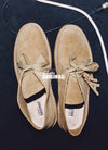 A.P.C. x Clarks - Desert Boots on floor near audio wire