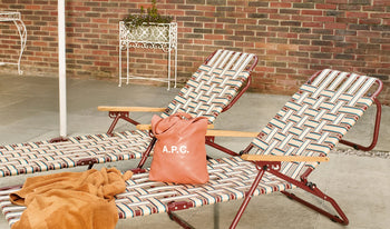 A.P.C. Men Sale Bags - Woman and man sitting together wearing coat and jeans.