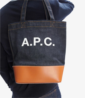 A.P.C. tote bags - Model holding tote bag behind back