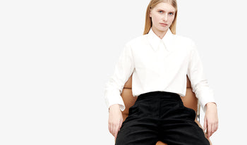 A.P.C. Women Sale Blouses, Shirts - Woman and man standing wearing collegiate clothing.