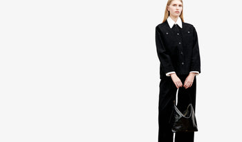 A.P.C. Women Sale Dresses - Woman wearing blue denim with brown bag.