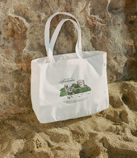 A.P.C. JJJJound Interaction #23 - JJJJound tote bag on beach.