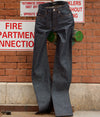A.P.C. Denim - a pair of jeans on a fire sprinkler