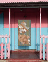 A.P.C. Quilts - a quilt hanging in a house porchway