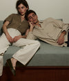 A.P.C. Spring Edit - woman and man model laying on a couch