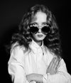 A.P.C. Eyewear - a black and white portrait of a woman model wearing sunglasses