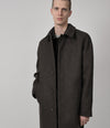 A.P.C. man posing in Fall 26 collection outfit
