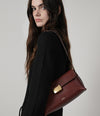 A.P.C. woman posing in Fall 26 collection outfit