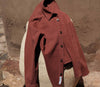 A.P.C. shirt draped over a rock 