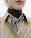 A.P.C. New Arrivals - close up of woman's neck showing layered clothing