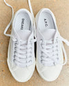A.P.C. Shoe Care Guide - Pair of white tennis shoes.