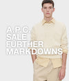 A.P.C. Summer Sale - man in A.P.C. attire standing against a neutral backdrop