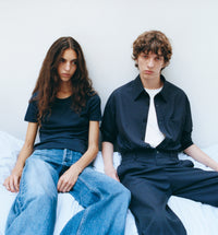 Woman and Man sitting on beg wearing A.P.C. clothing