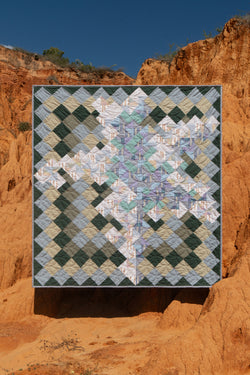 Quilt suspended between hills