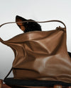 brown leather bag with a dog