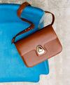 A.P.C. Box Leather - Brown Astra bag on chair.