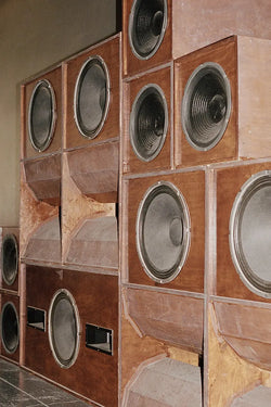 A.P.C. Music - Old speakers stacked on top of each other