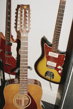 A.P.C. Music 2 - 3 guitars next to eachother