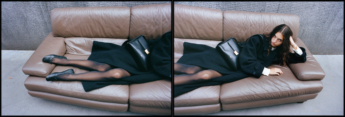 A.P.C. Simone bag - woman laying on couch in a fall 26 outfit