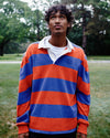A man standing in a park looking up at the sky