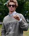 Man in A.P.C. Marc Jacobs apparel standing in a park